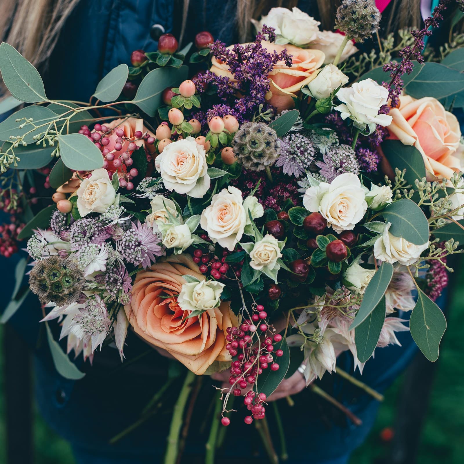 A large bouquet of roses and wildflowers